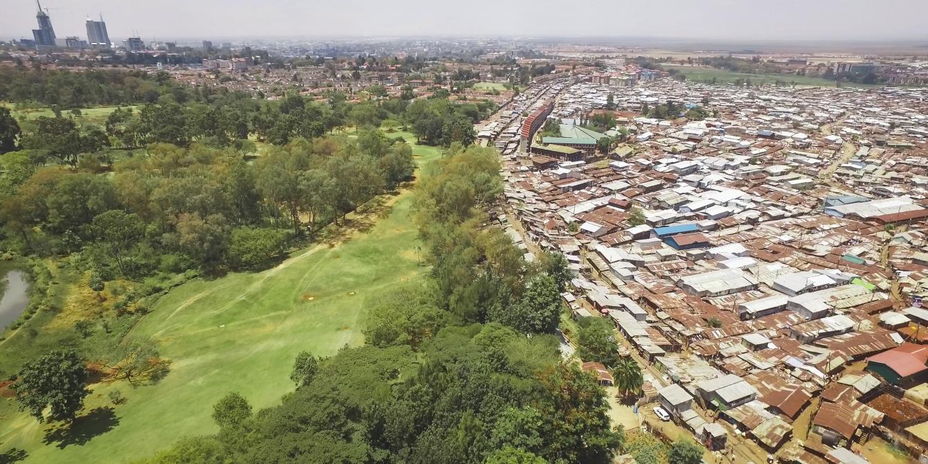 The chaos, noise, and density of the slum is neatly juxtaposed with the orderly calm green of the Royal Nairobi Golf Club, which opened in 1906. Unequal Scenes - by Johnny Miller The chaos, noise, and density of the slum is neatly juxtaposed with the orderly calm green of the Royal Nairobi Golf Club, which opened in 1906. Unequal Scenes - by Johnny Miller